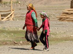 17 Mother Holding Daughters Hand Walking Through Yilik Village On My Trek To K2 China.jpg